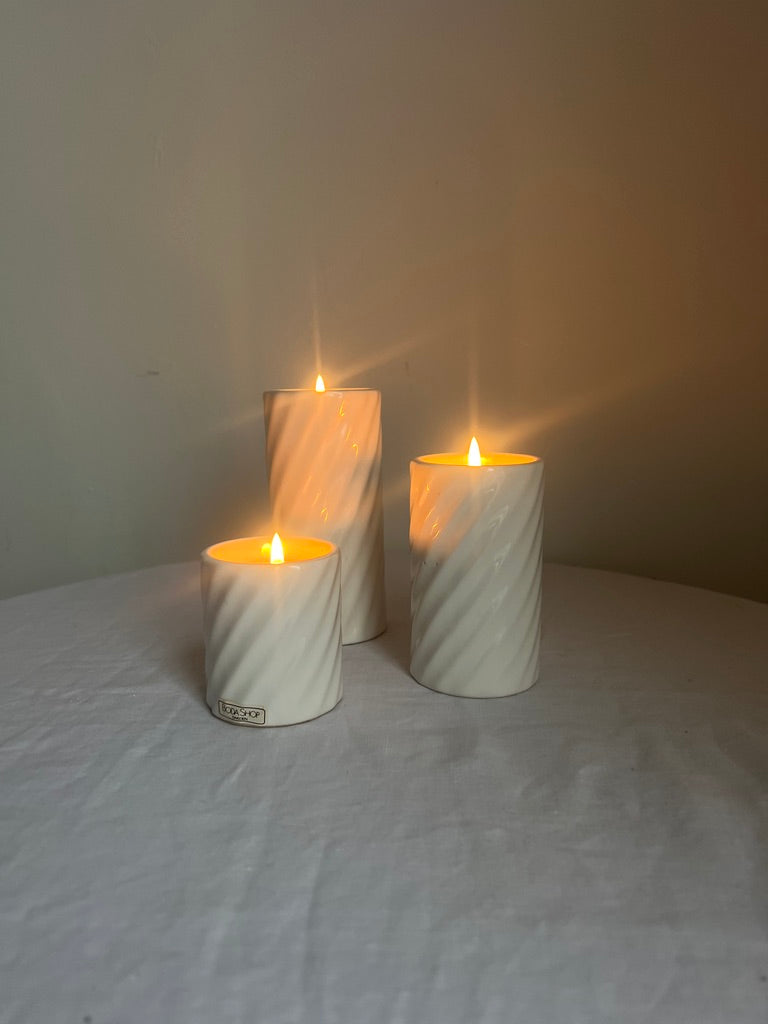 SET OF THREE WHITE CANDLE HOLDERS