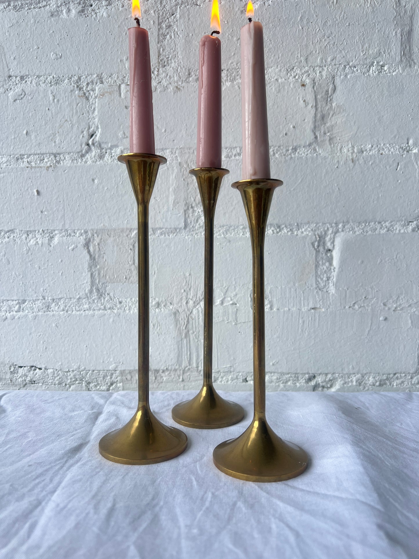 TRIO OF BRASS CANDLE HOLDERS