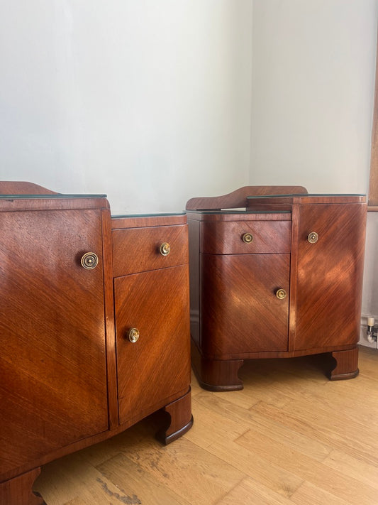 A stunning pair of curved art deco walnut bedside tables