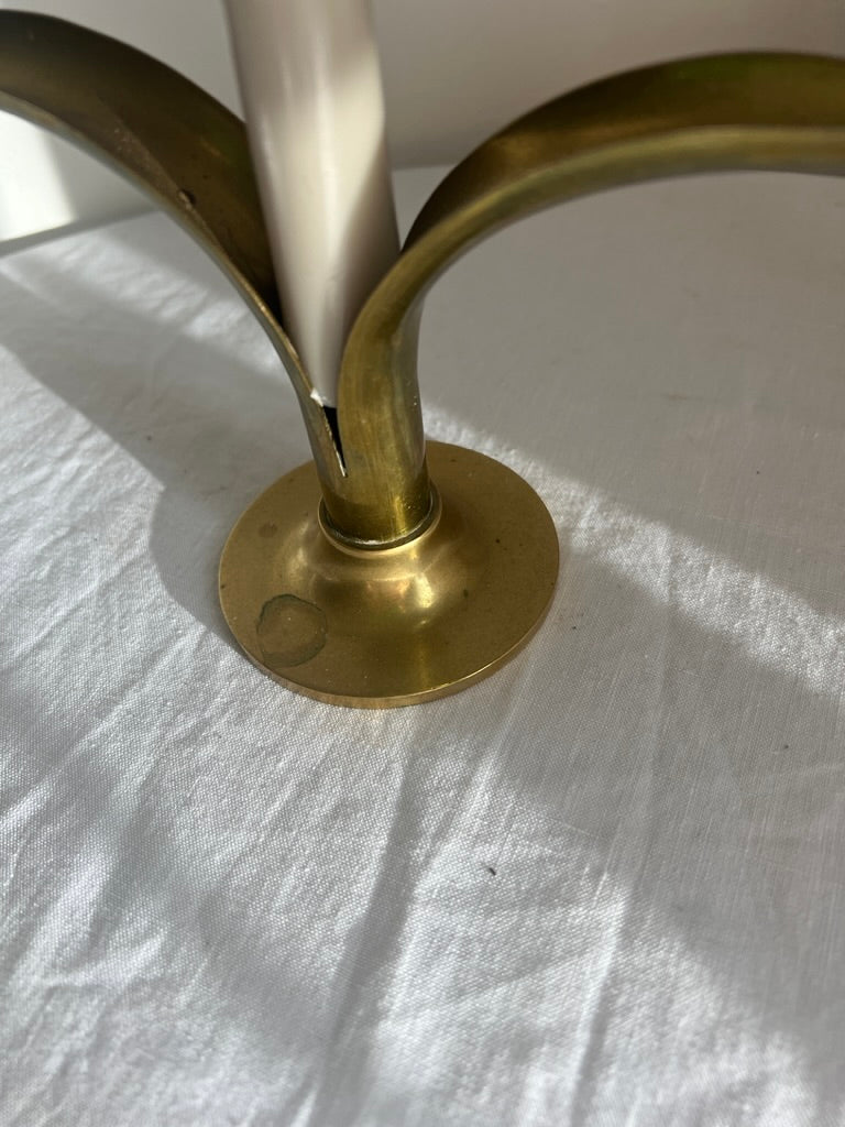A pair of brass Swedish ‘leaf’ candle holders