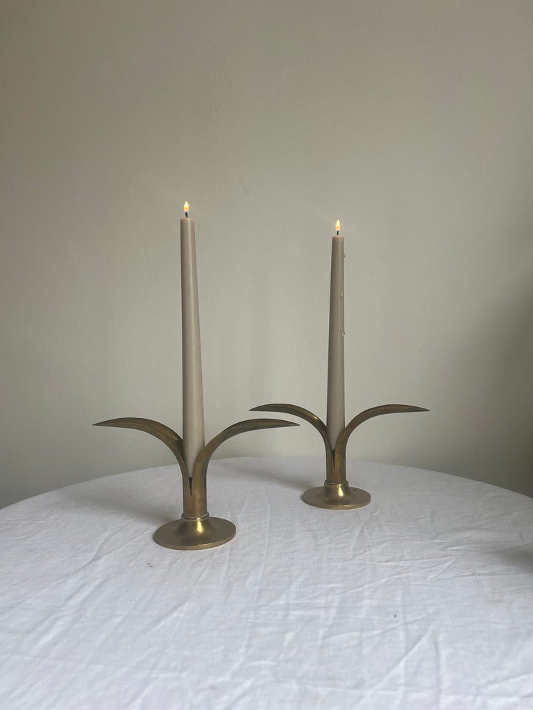 A pair of brass Swedish ‘leaf’ candle holders