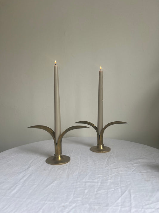 A pair of brass Swedish ‘leaf’ candle holders