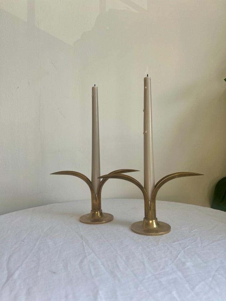 A pair of brass Swedish ‘leaf’ candle holders