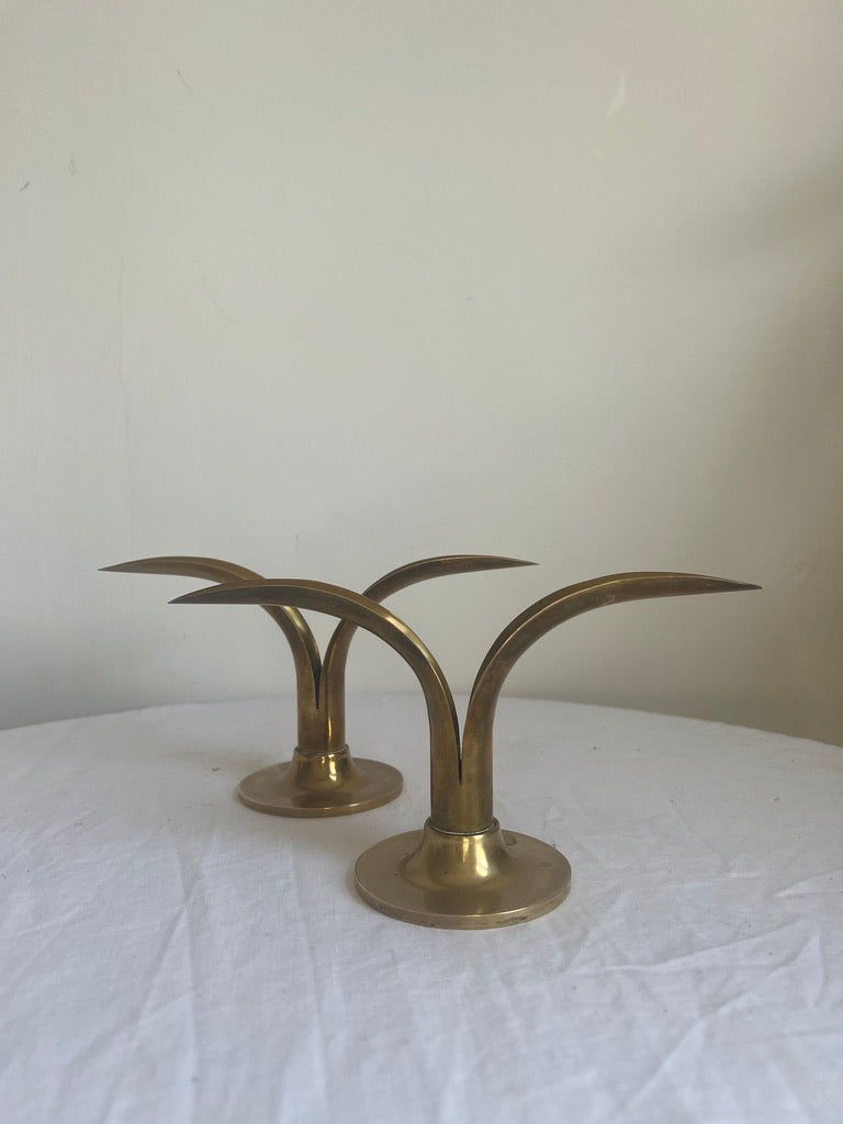 A pair of brass Swedish ‘leaf’ candle holders