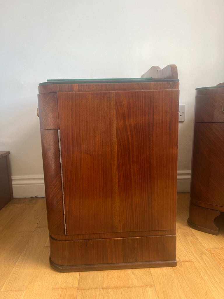 A stunning pair of curved art deco walnut bedside tables