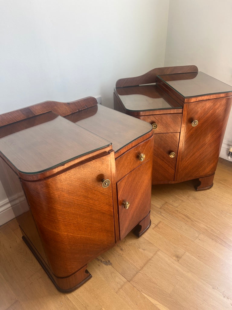 A stunning pair of curved art deco walnut bedside tables