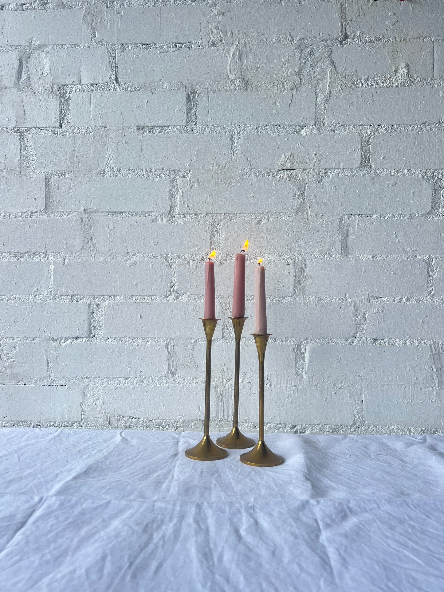 TRIO OF BRASS CANDLE HOLDERS