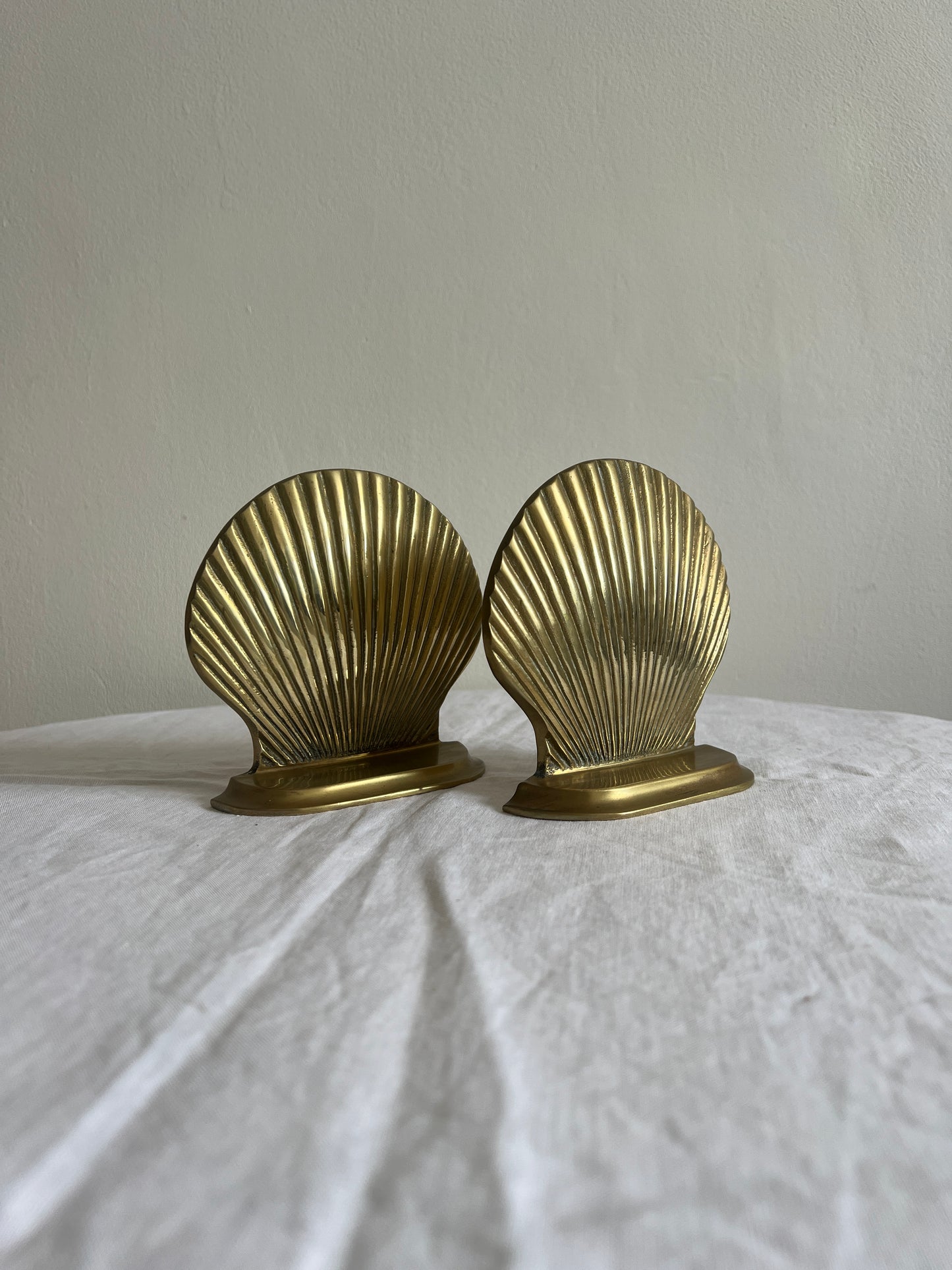 Pair of decorative brass seashell book ends