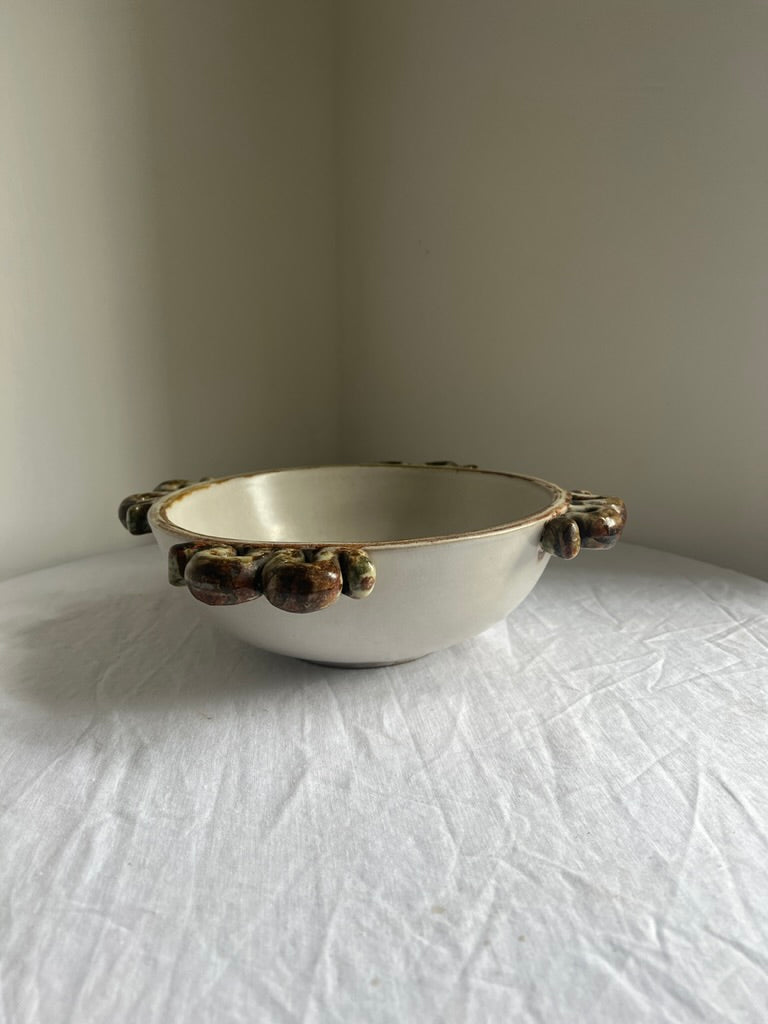 Ceramic serving bowl with wiggle handles, by Denby