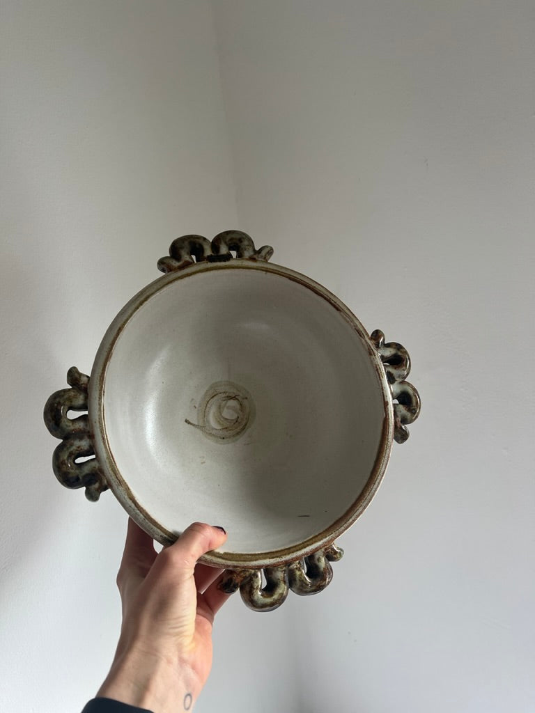 Ceramic serving bowl with wiggle handles, by Denby