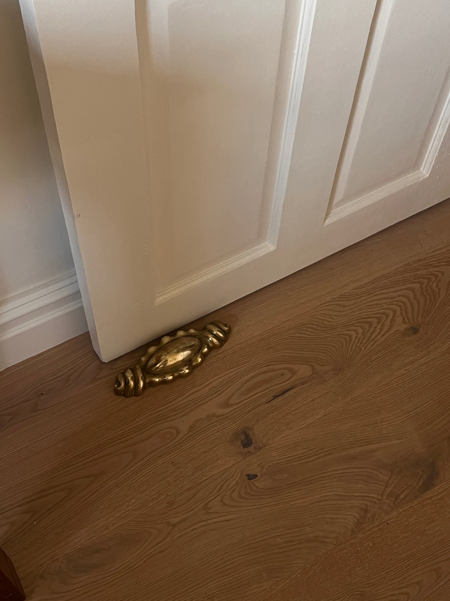 WEIGHTED BRASS SHELL DOOR STOP
