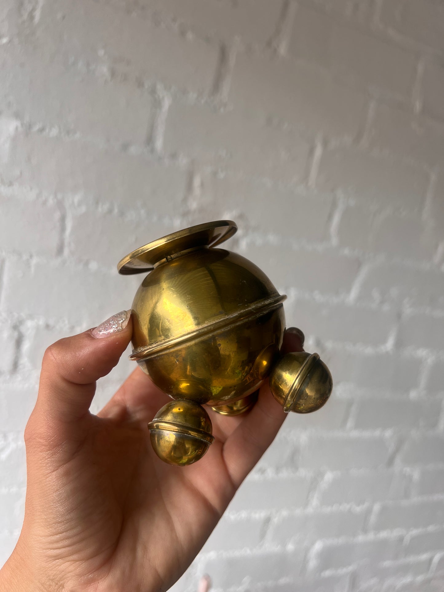 PAIR OF SMALL BRASS SPHERE CANDLE HOLDERS