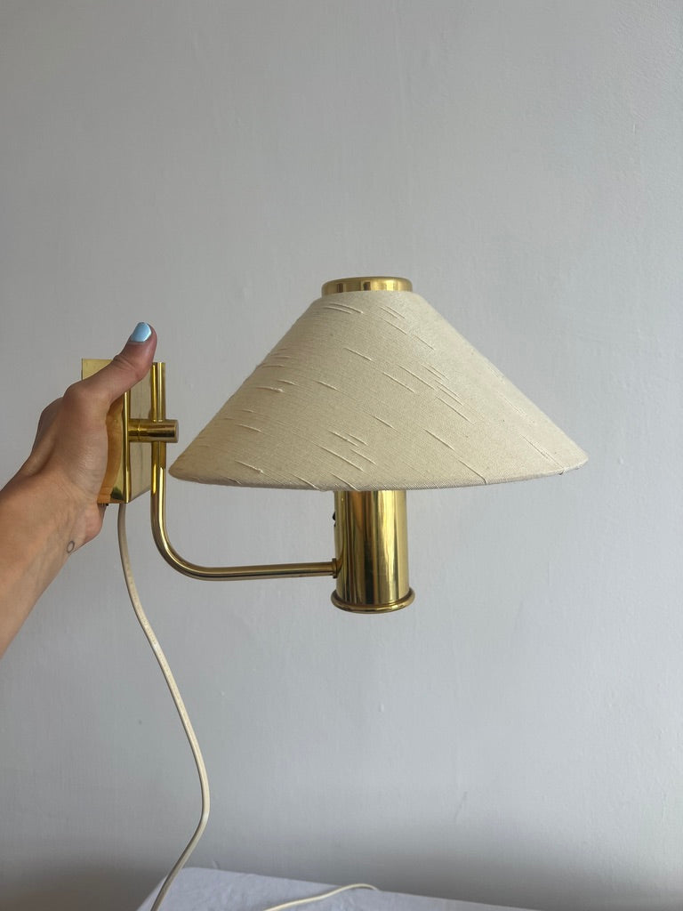 Pair of brass wall lights with linen cone shades