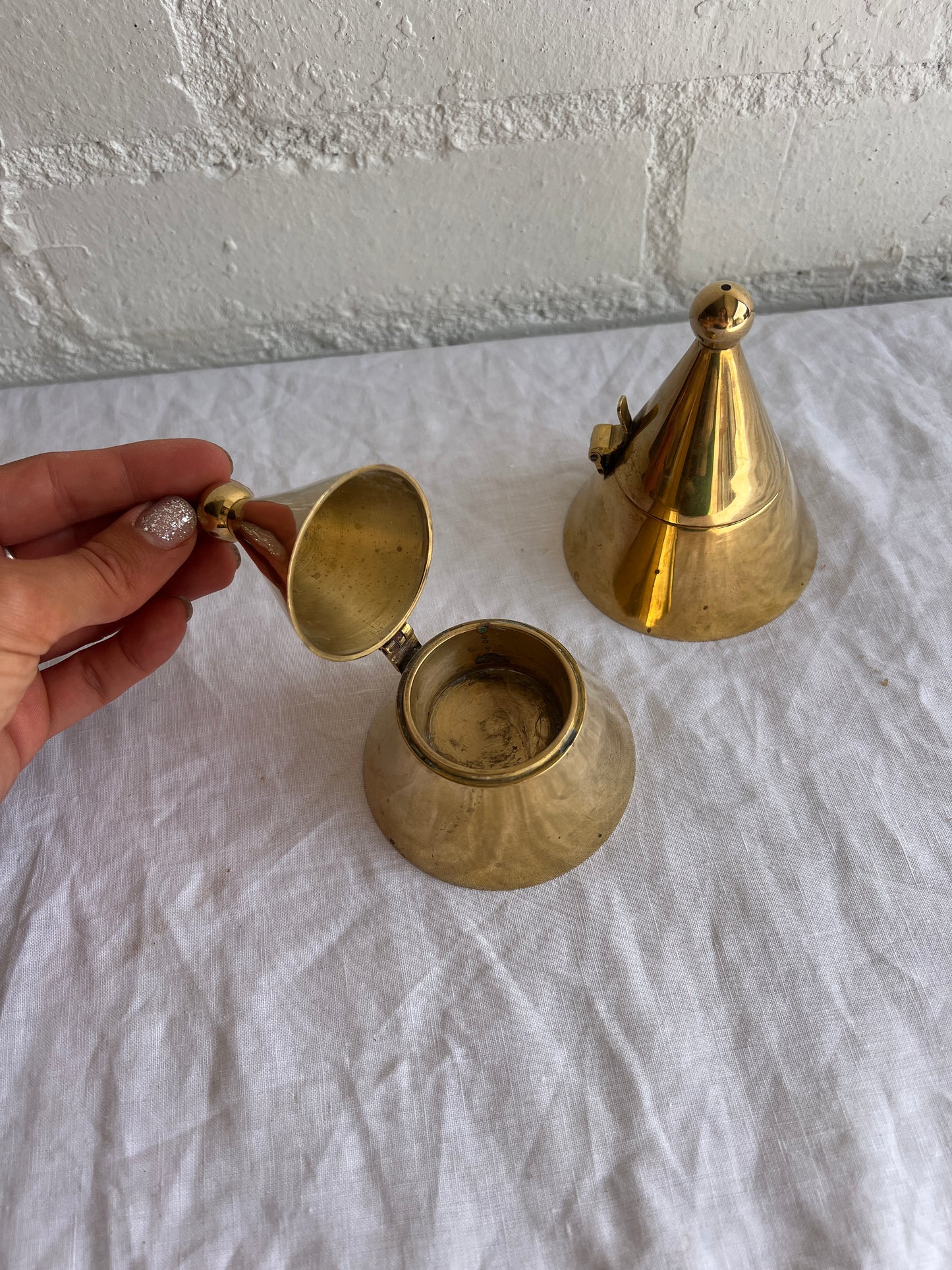 PAIR OF BRASS CONE TEA LIGHT HOLDERS