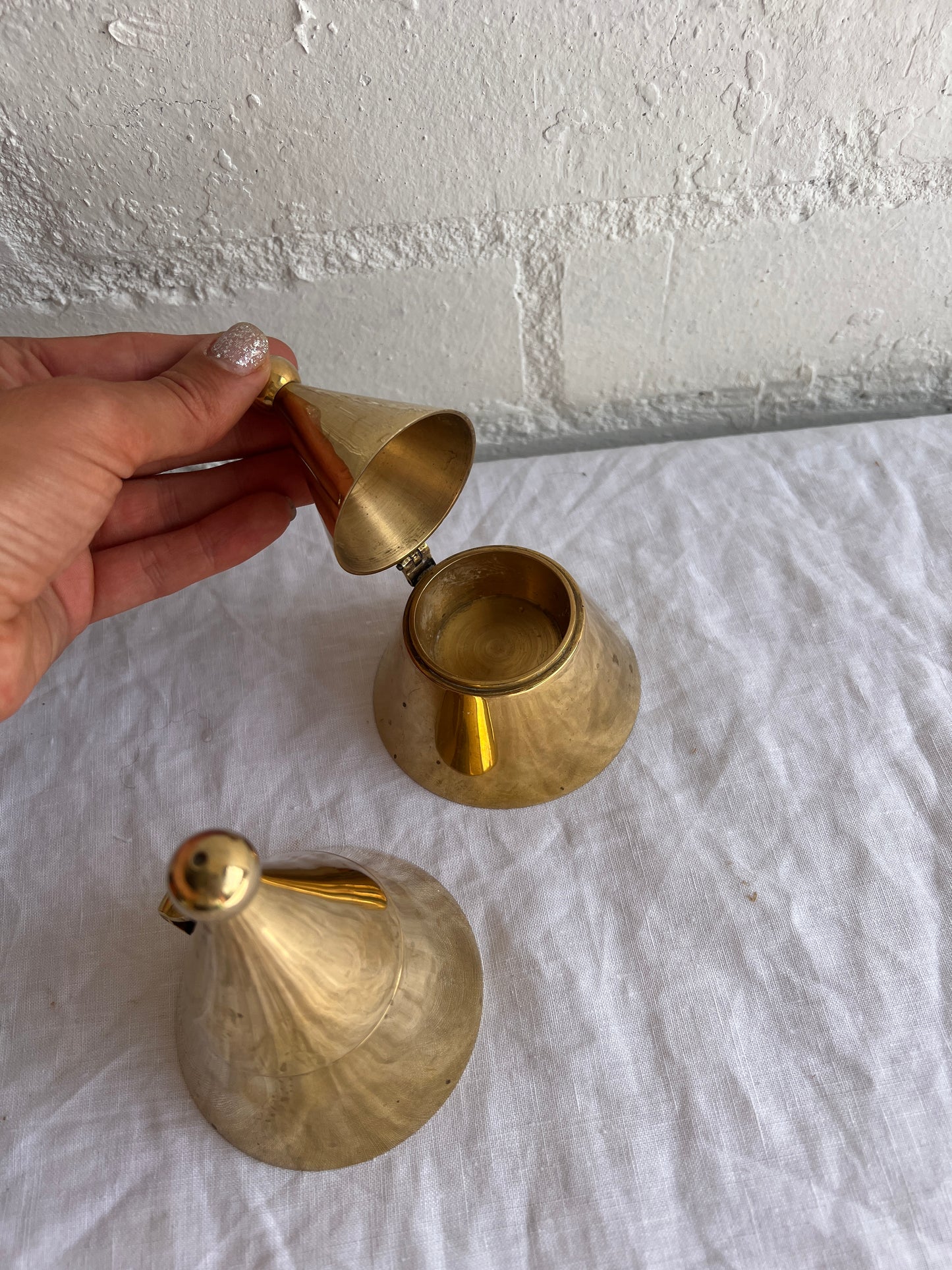 PAIR OF BRASS CONE TEA LIGHT HOLDERS