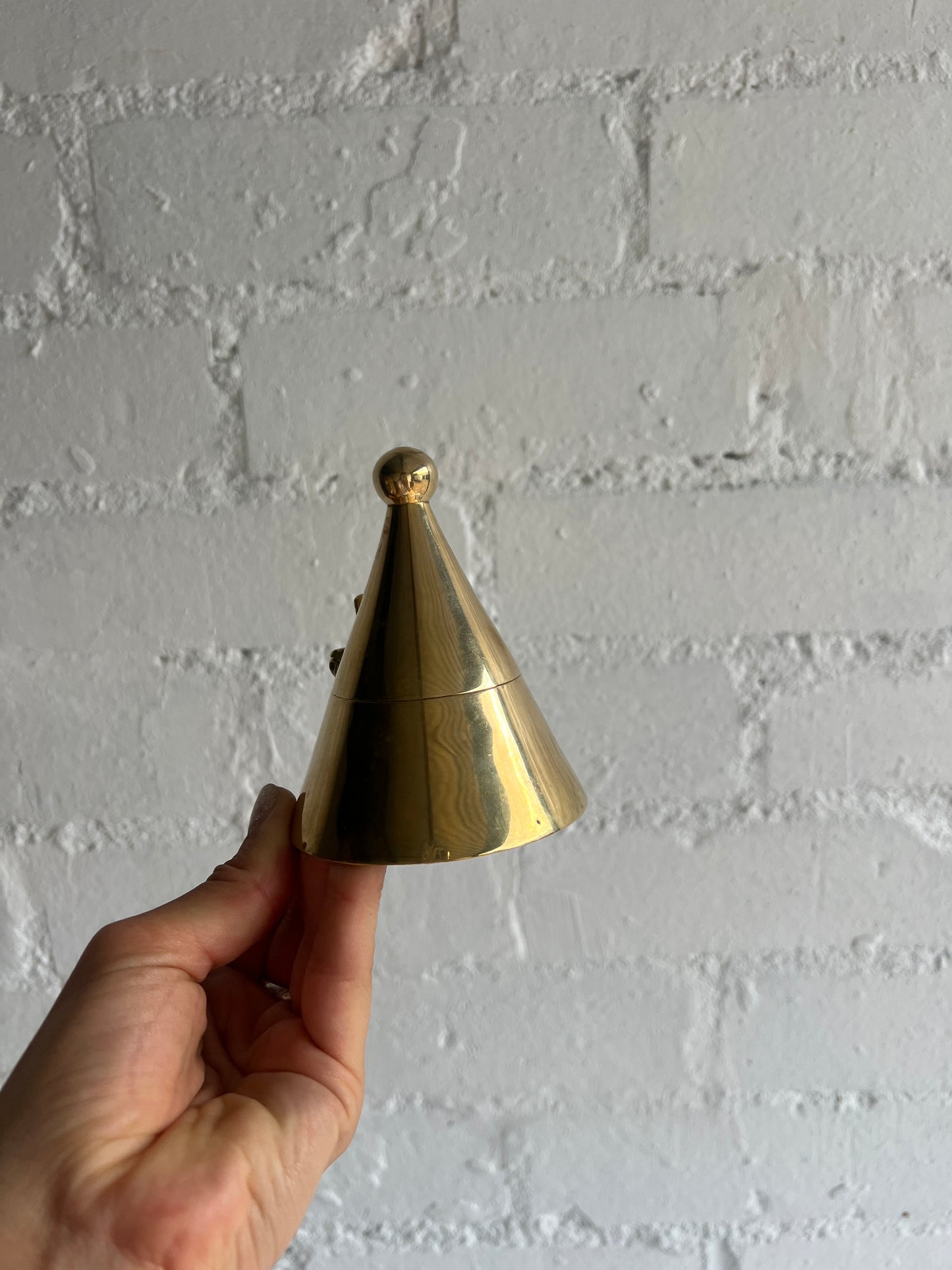 PAIR OF BRASS CONE TEA LIGHT HOLDERS