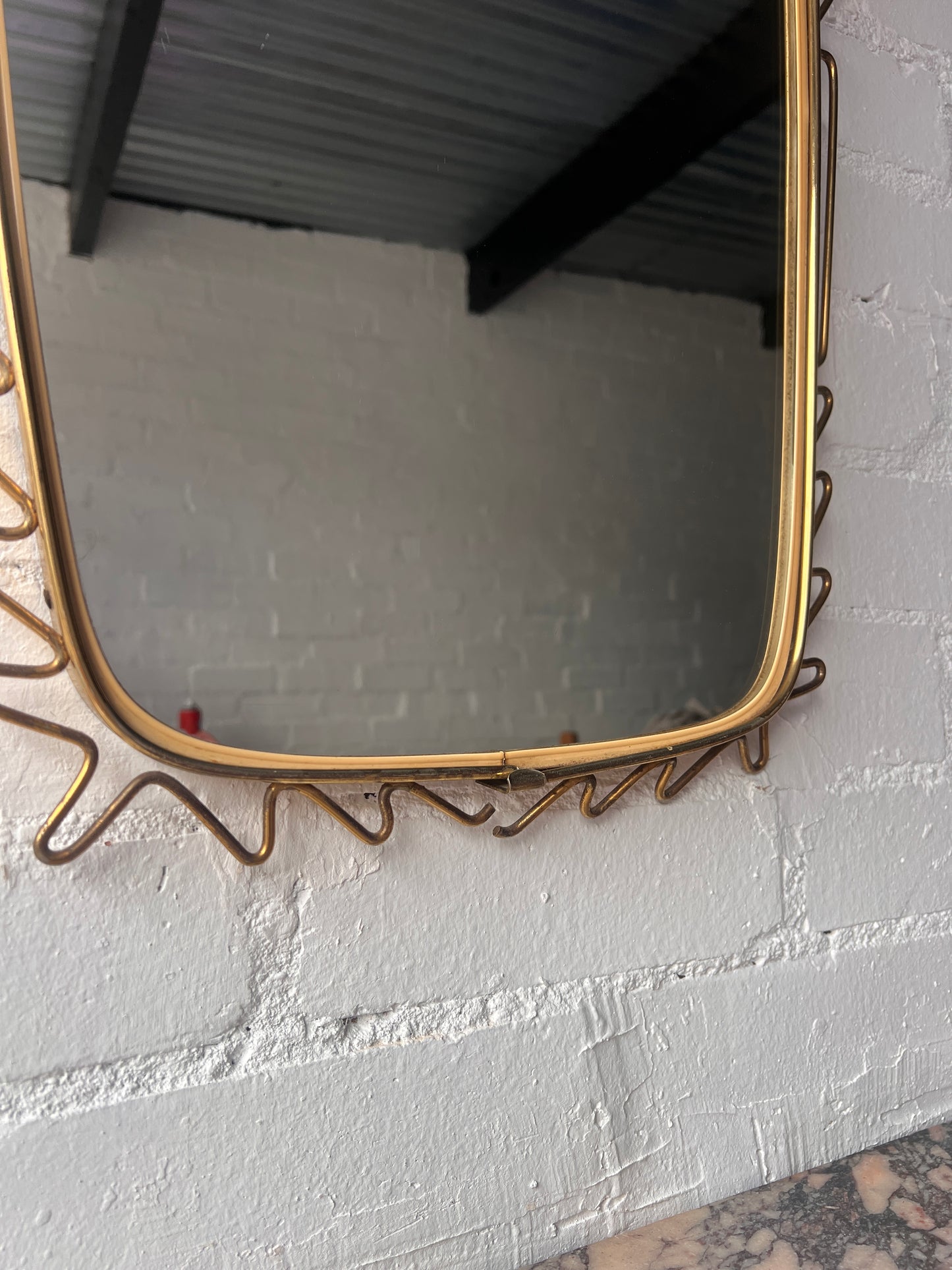 MID CENTURY BRASS WIGGLE MIRROR