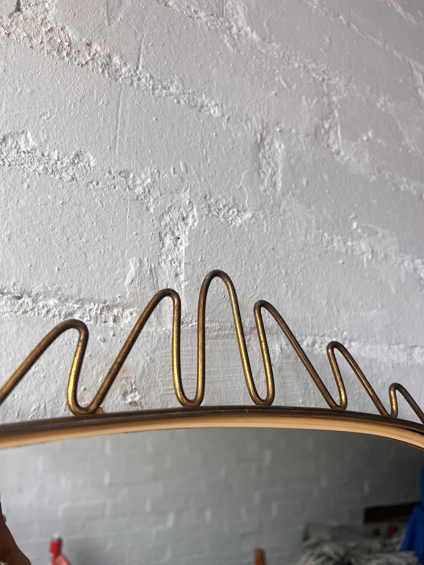 MID CENTURY BRASS WIGGLE MIRROR