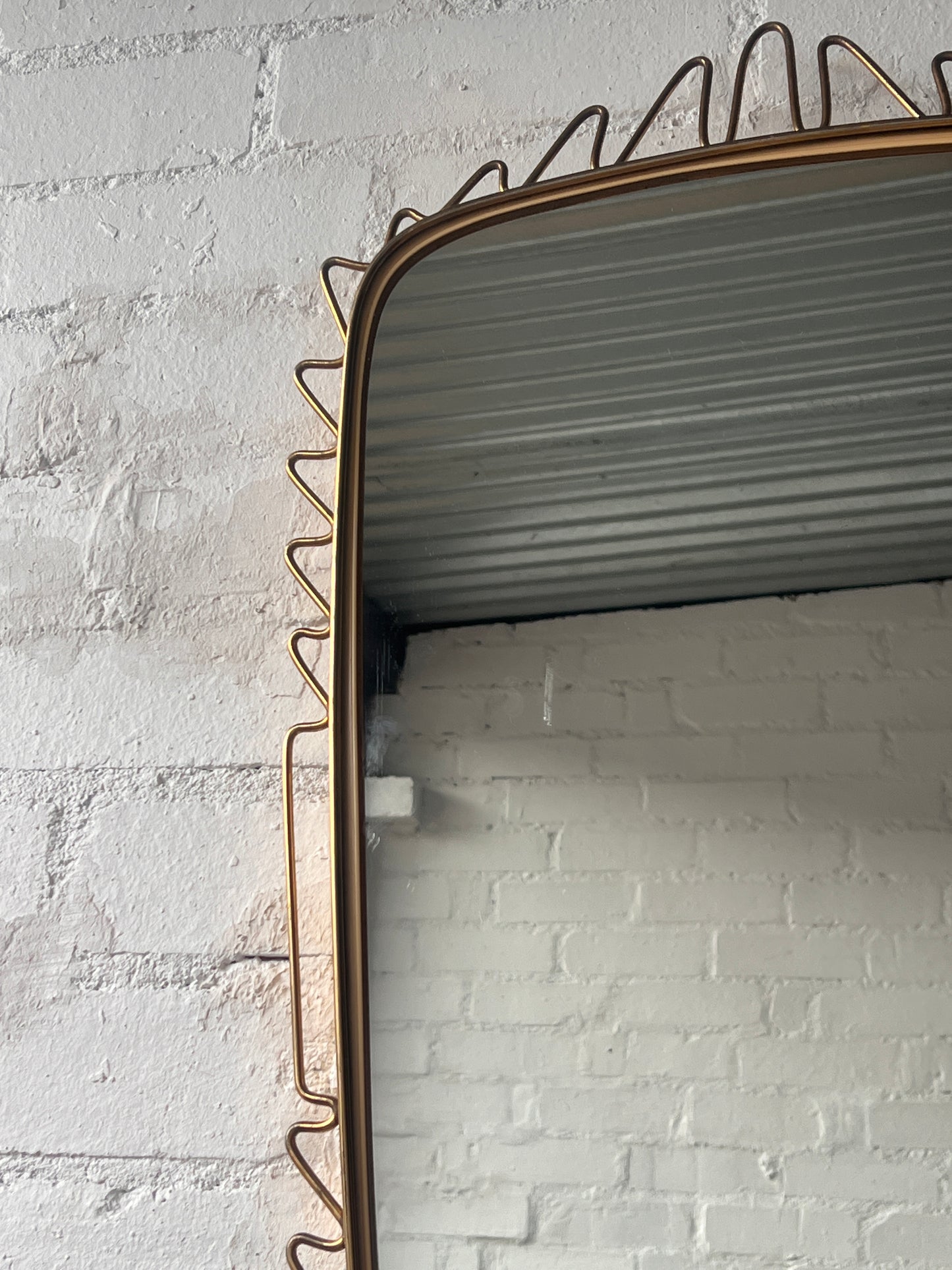 MID CENTURY BRASS WIGGLE MIRROR
