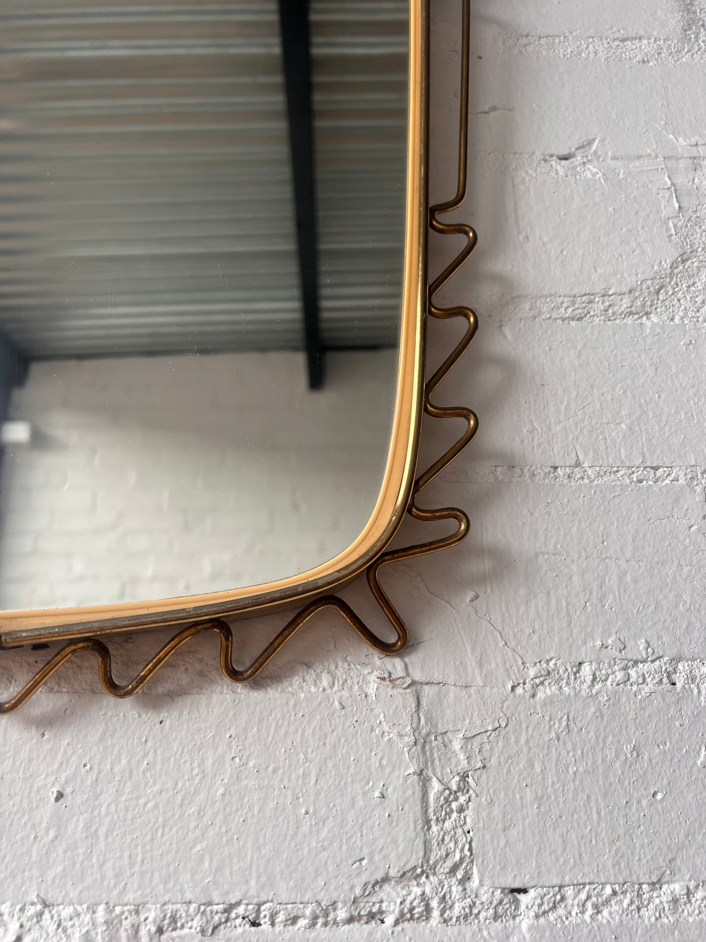 MID CENTURY BRASS WIGGLE MIRROR