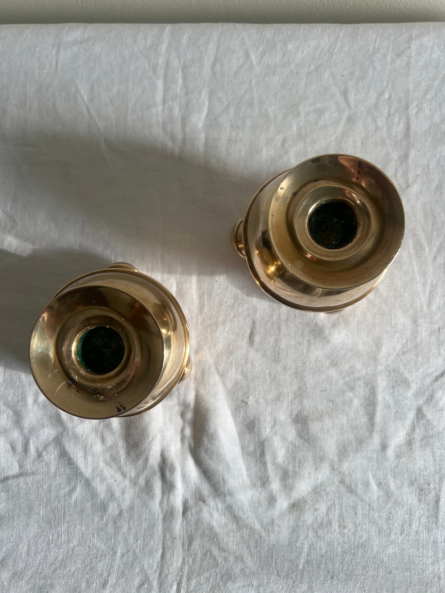 PAIR OF BRASS SPHERE CANDLE HOLDERS