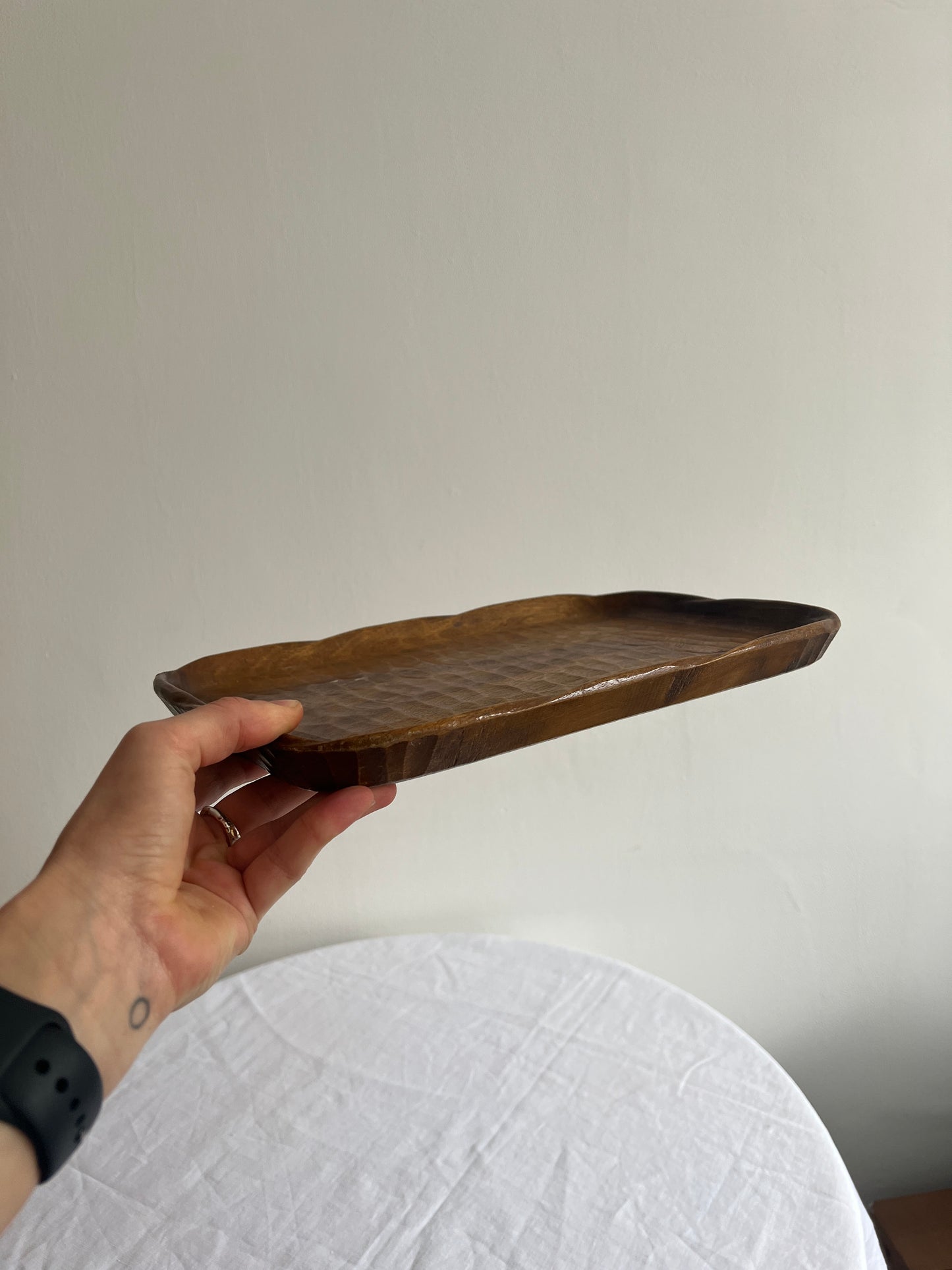 Vintage wooden display tray with croc style grooves and a wavy edge