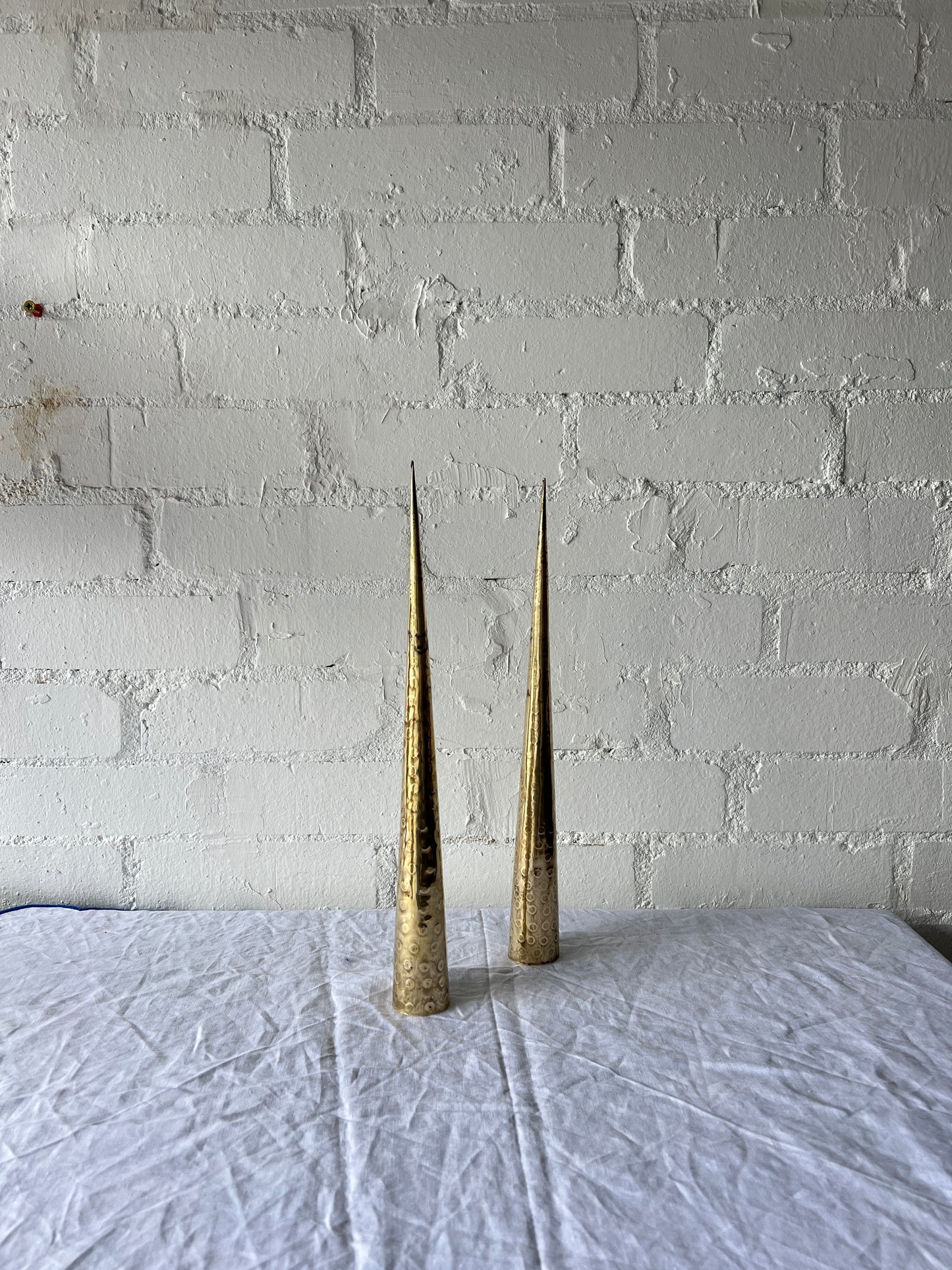 PAIR OF BRASS TALL CONES