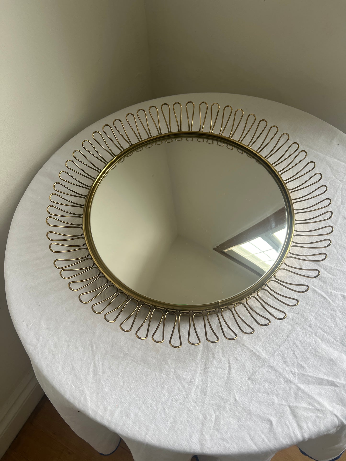 Circular brass convex mirror in the style of Josef Frank