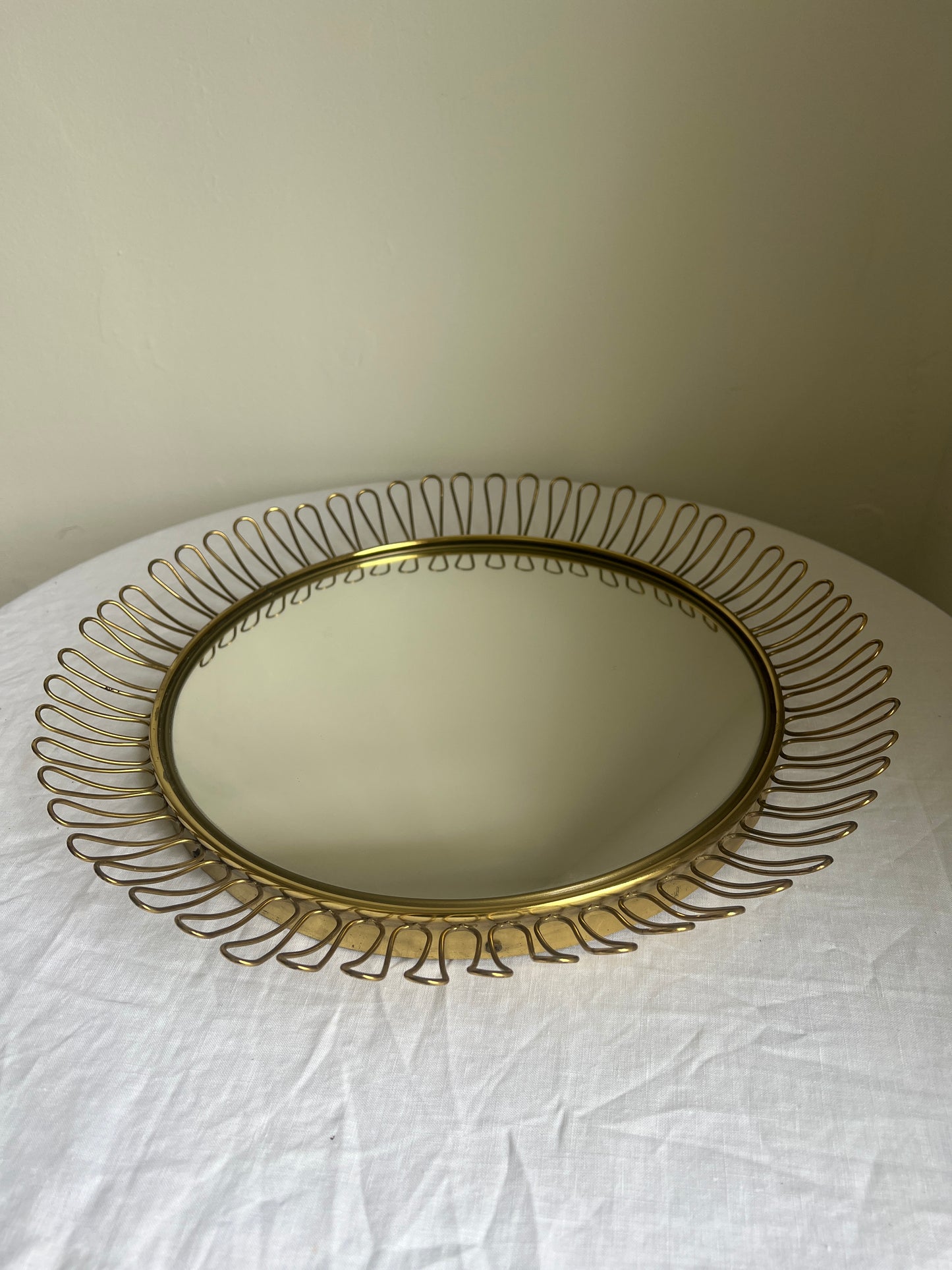 Circular brass convex mirror in the style of Josef Frank