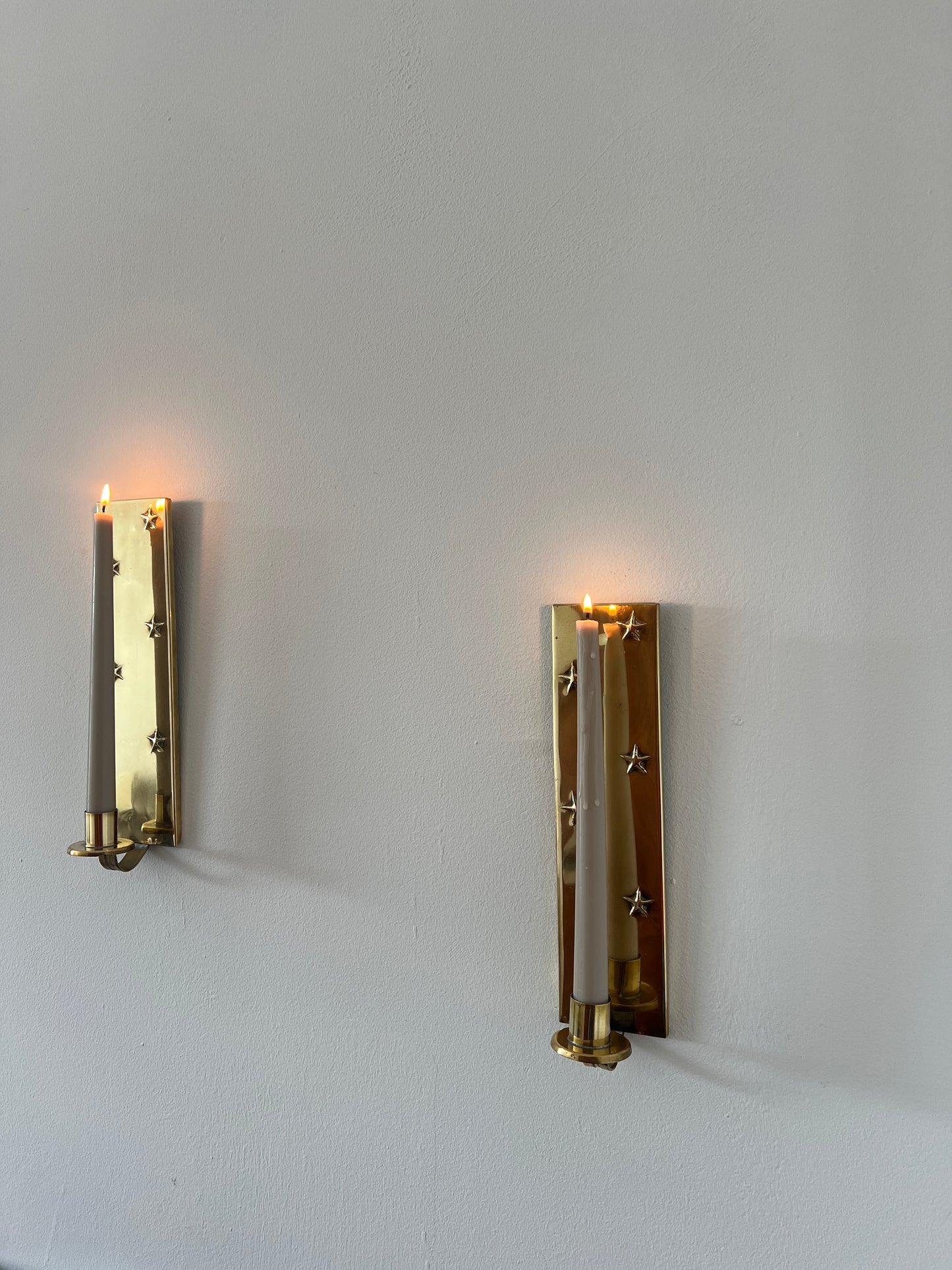 Pair of brass star sconces
