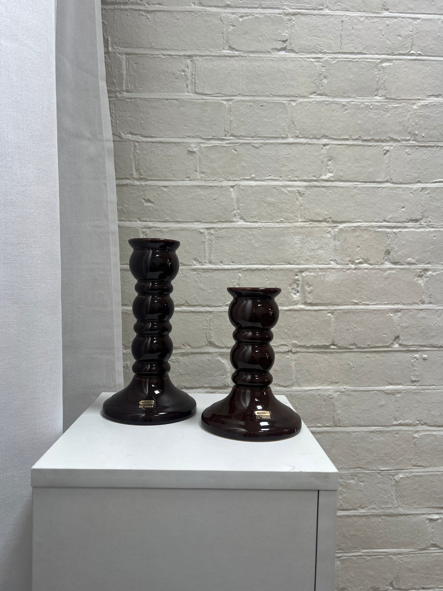 PAIR OF GLOSSY BROWN CANDLE STICKS