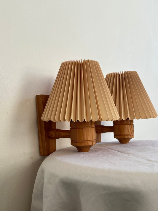 PAIR OF PINE WALL LIGHTS WITH PEACH PLEATED SHADES