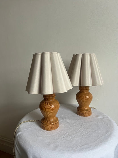 PAIR OF WOODEN BEDSIDE LAMPS WITH PETAL SHADES