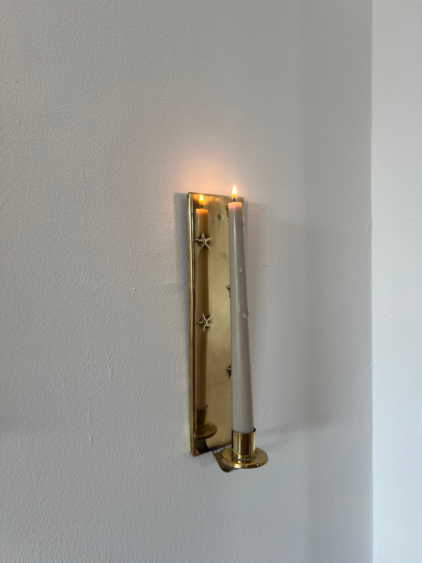 Pair of brass star sconces