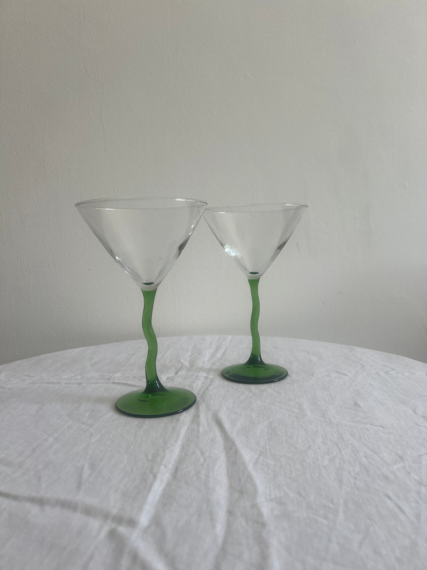 Pair of green wiggle stem cocktail glasses