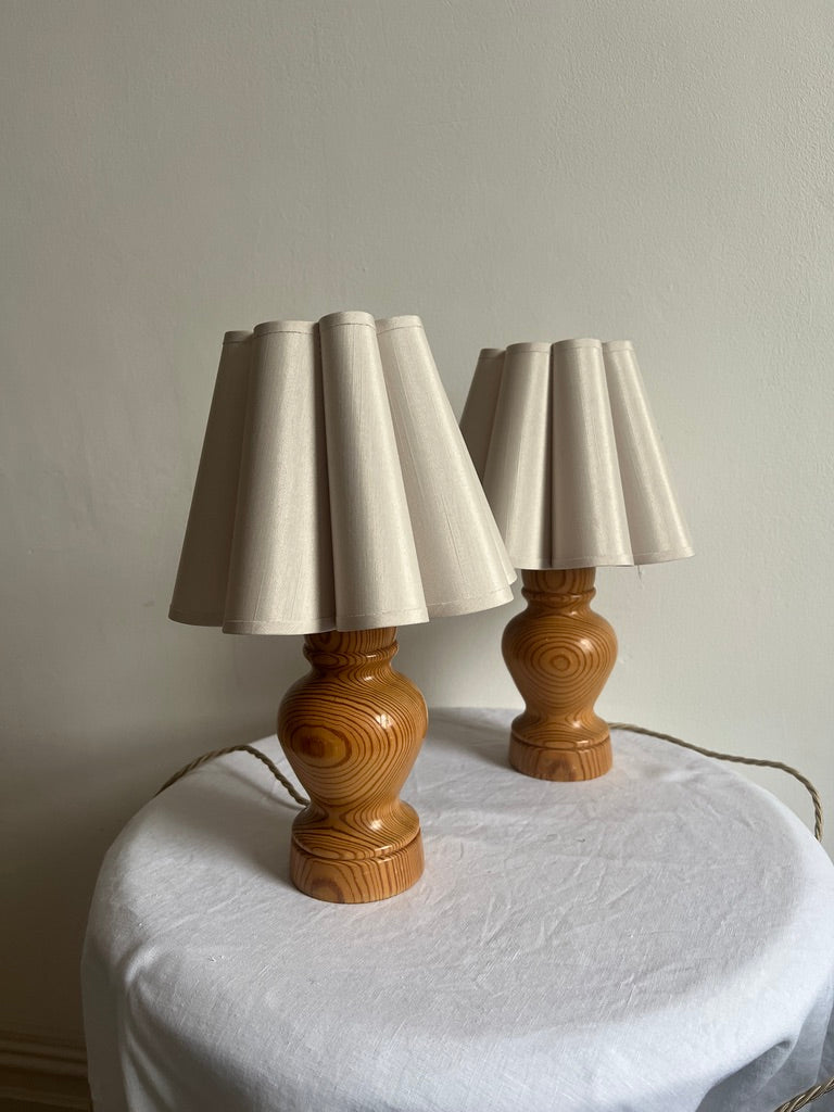 PAIR OF WOODEN BEDSIDE LAMPS WITH PETAL SHADES