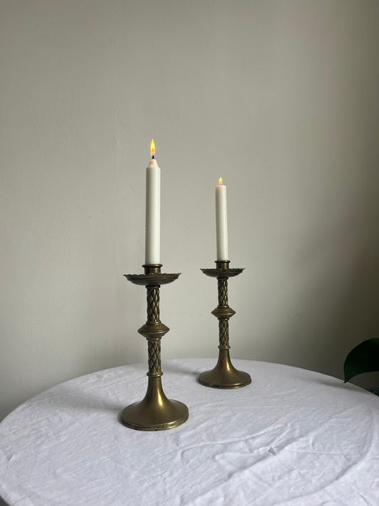 Pair of vintage tall brass candle sticks