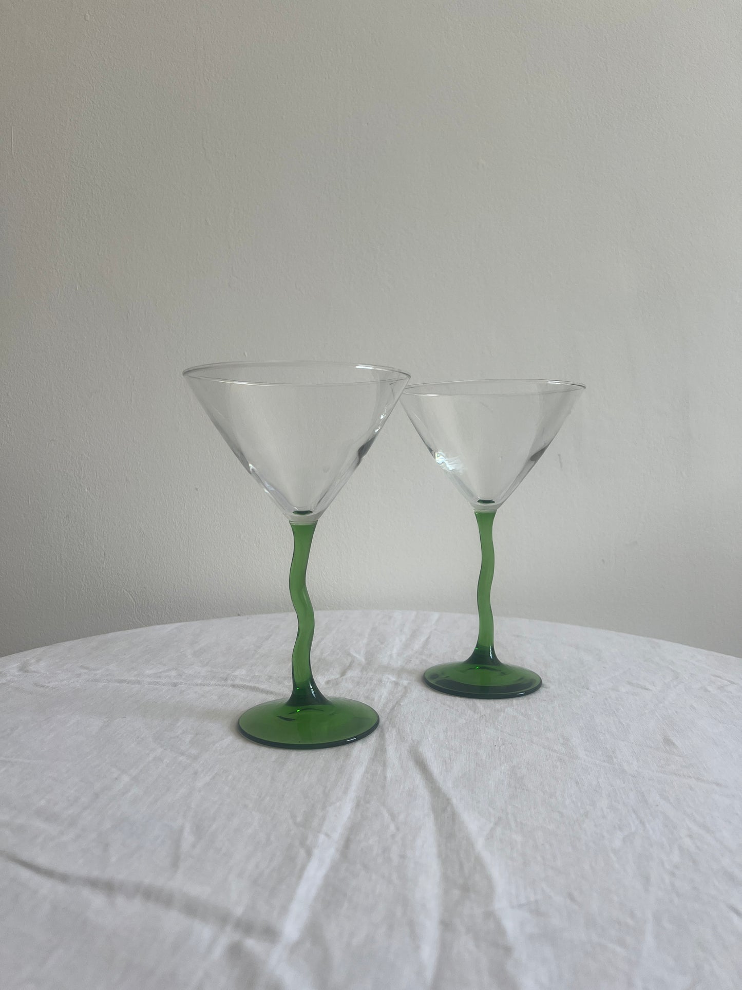 Pair of green wiggle stem cocktail glasses