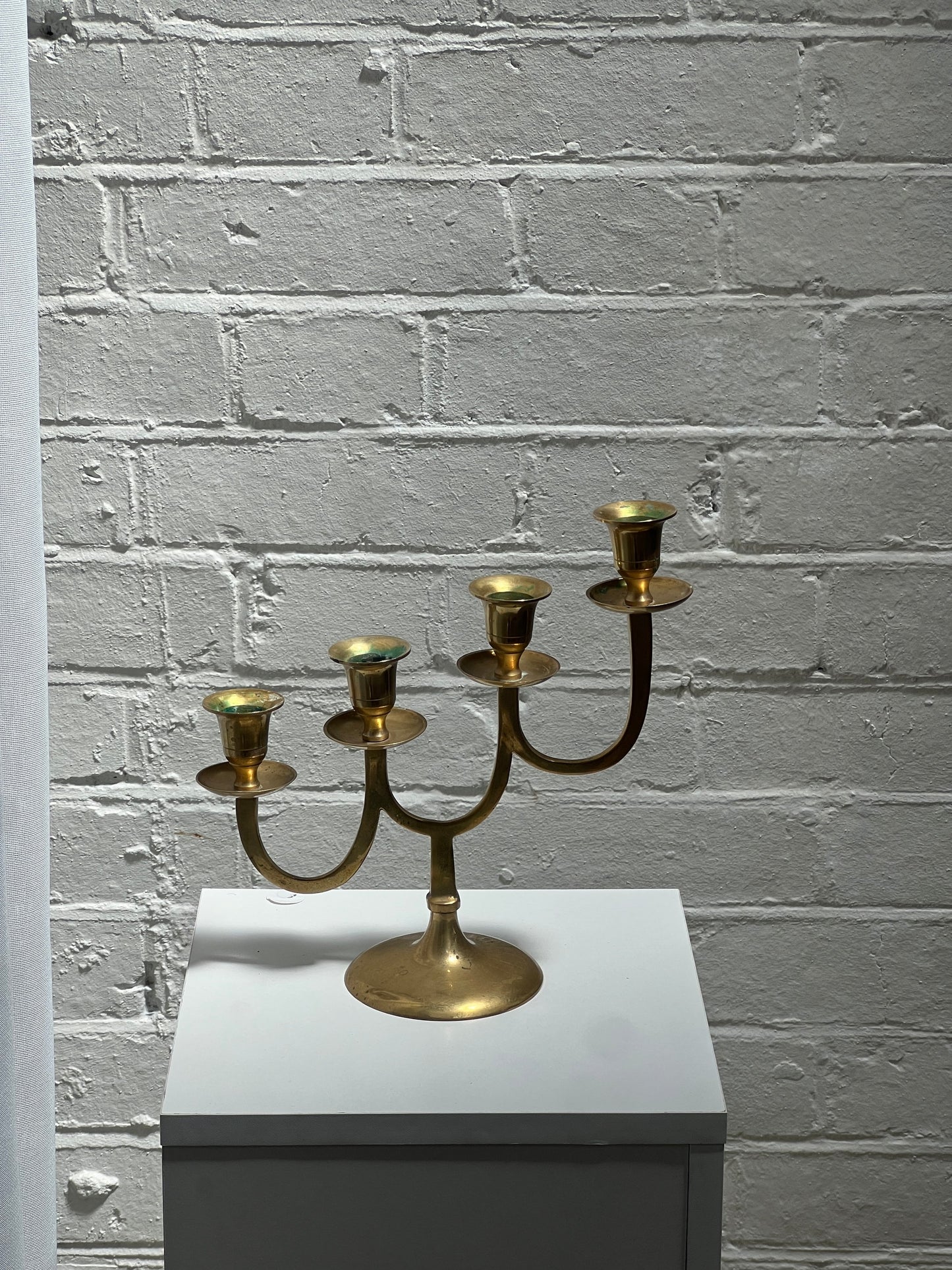 STAGGERED BRASS CANDLE HOLDER