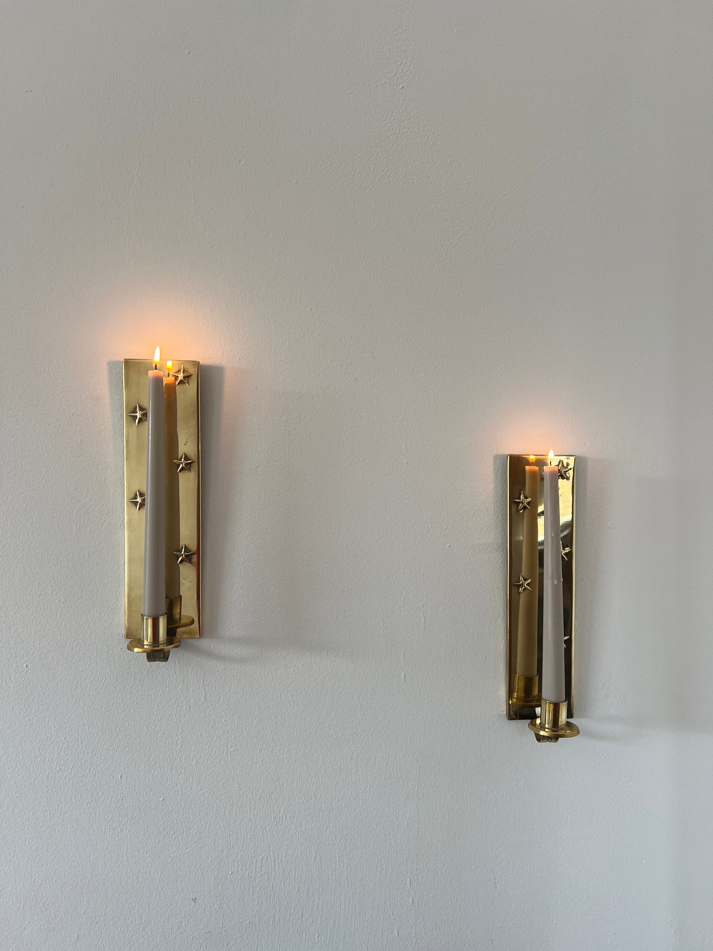 Pair of brass star sconces
