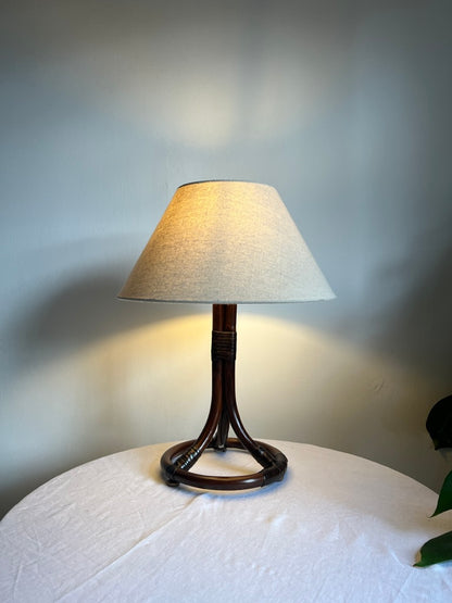 Mid Century Swedish rattan circular based lamp with linen shade