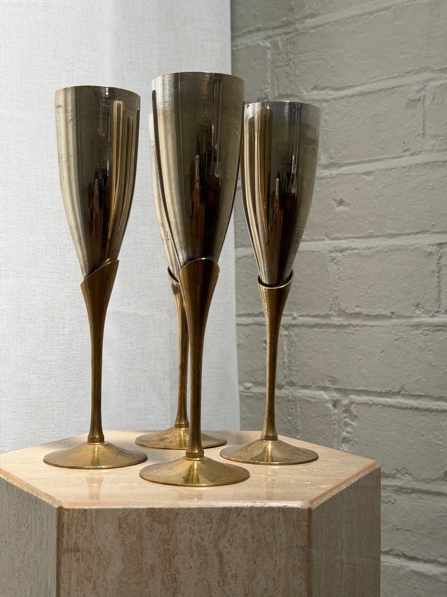 SET OF FOUR BRASS & CHROME FLUTES