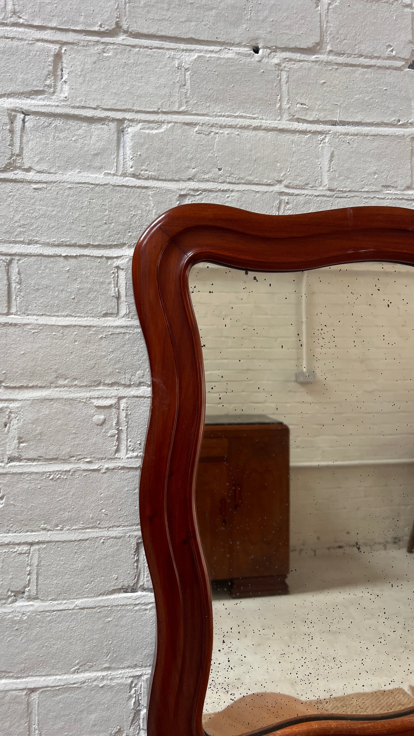 FOXED WOODEN WAVY MIRROR