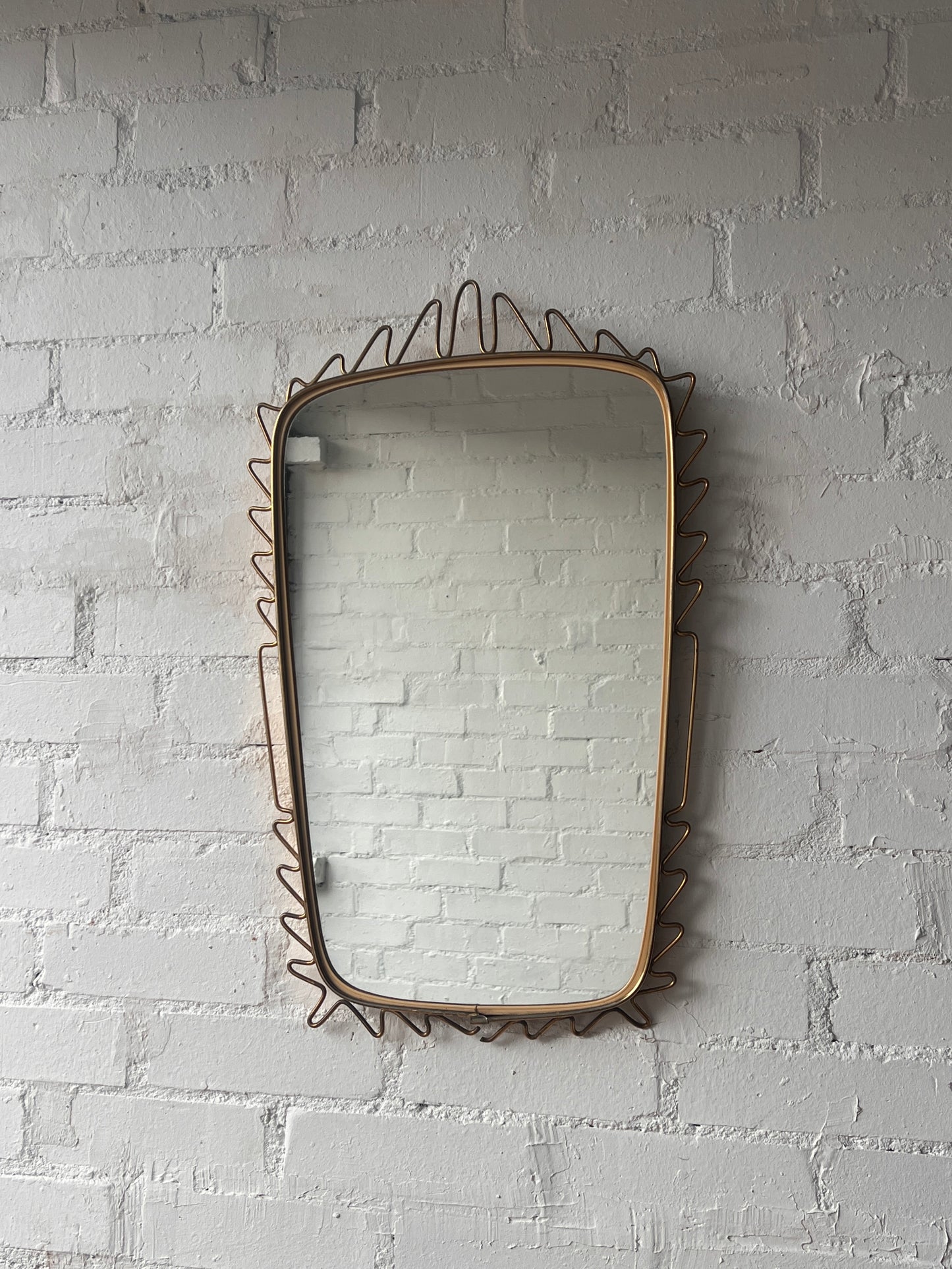 MID CENTURY BRASS WIGGLE MIRROR