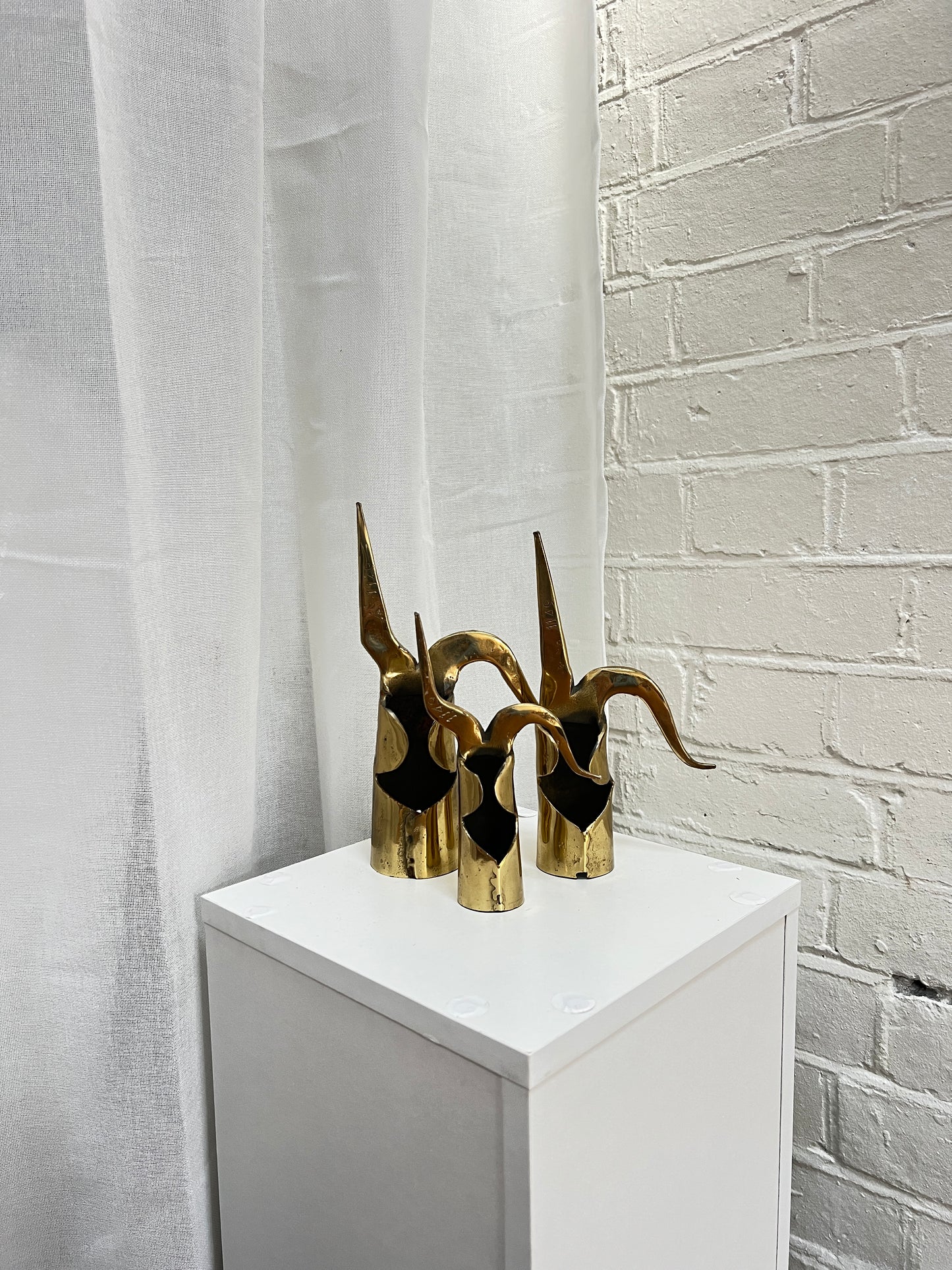 THREE BRASS ORNAMENTS