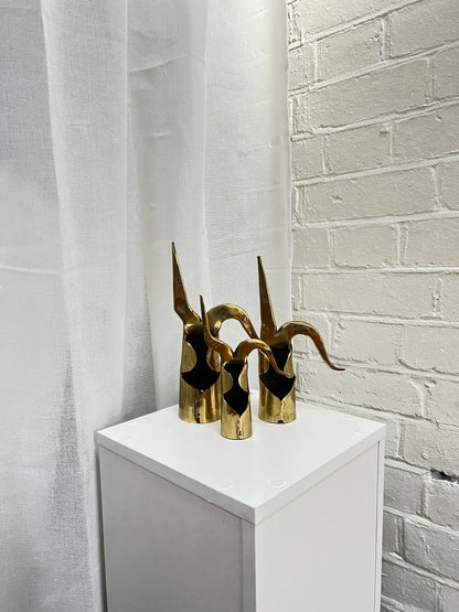 THREE BRASS ORNAMENTS