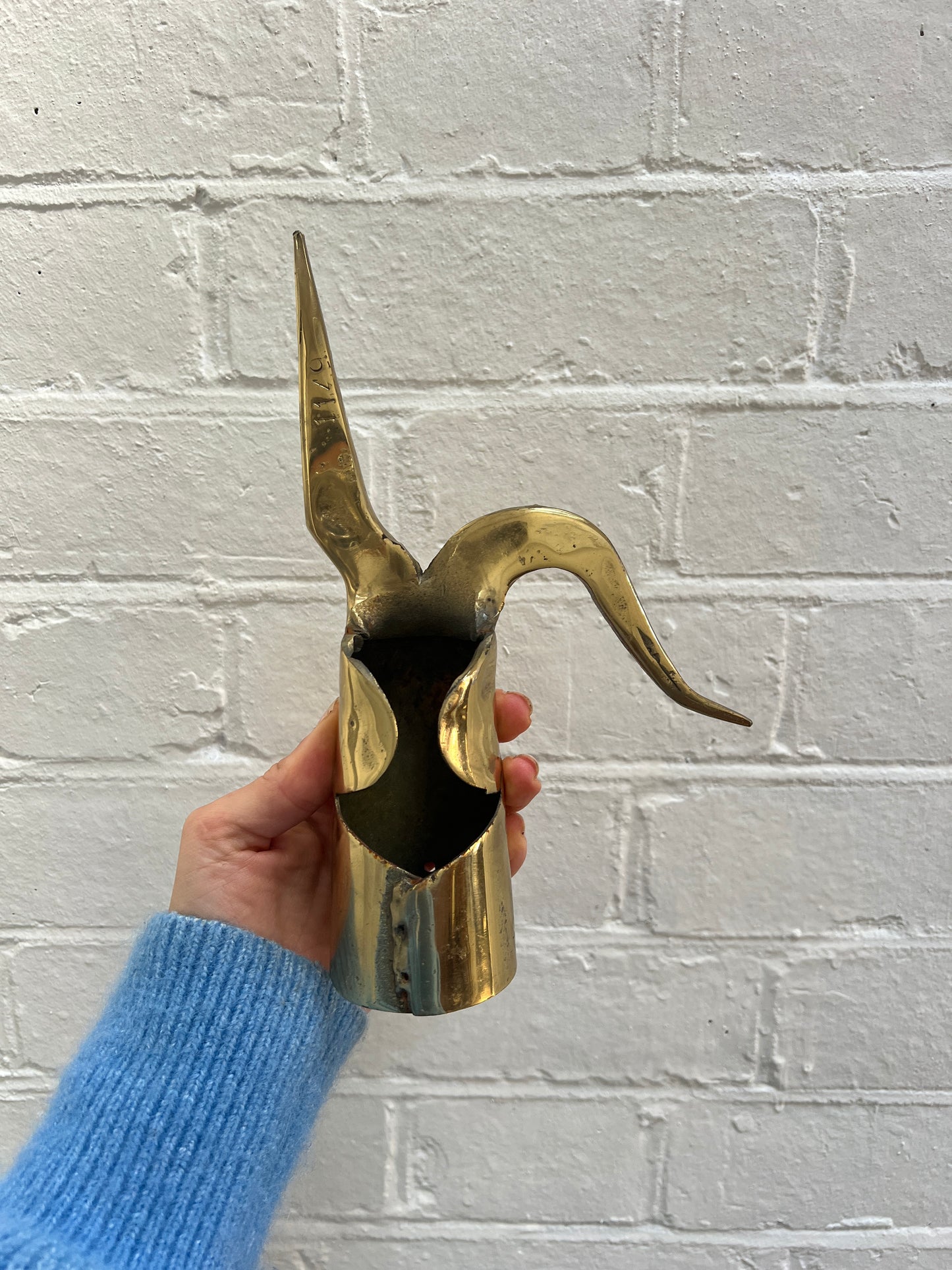 THREE BRASS ORNAMENTS