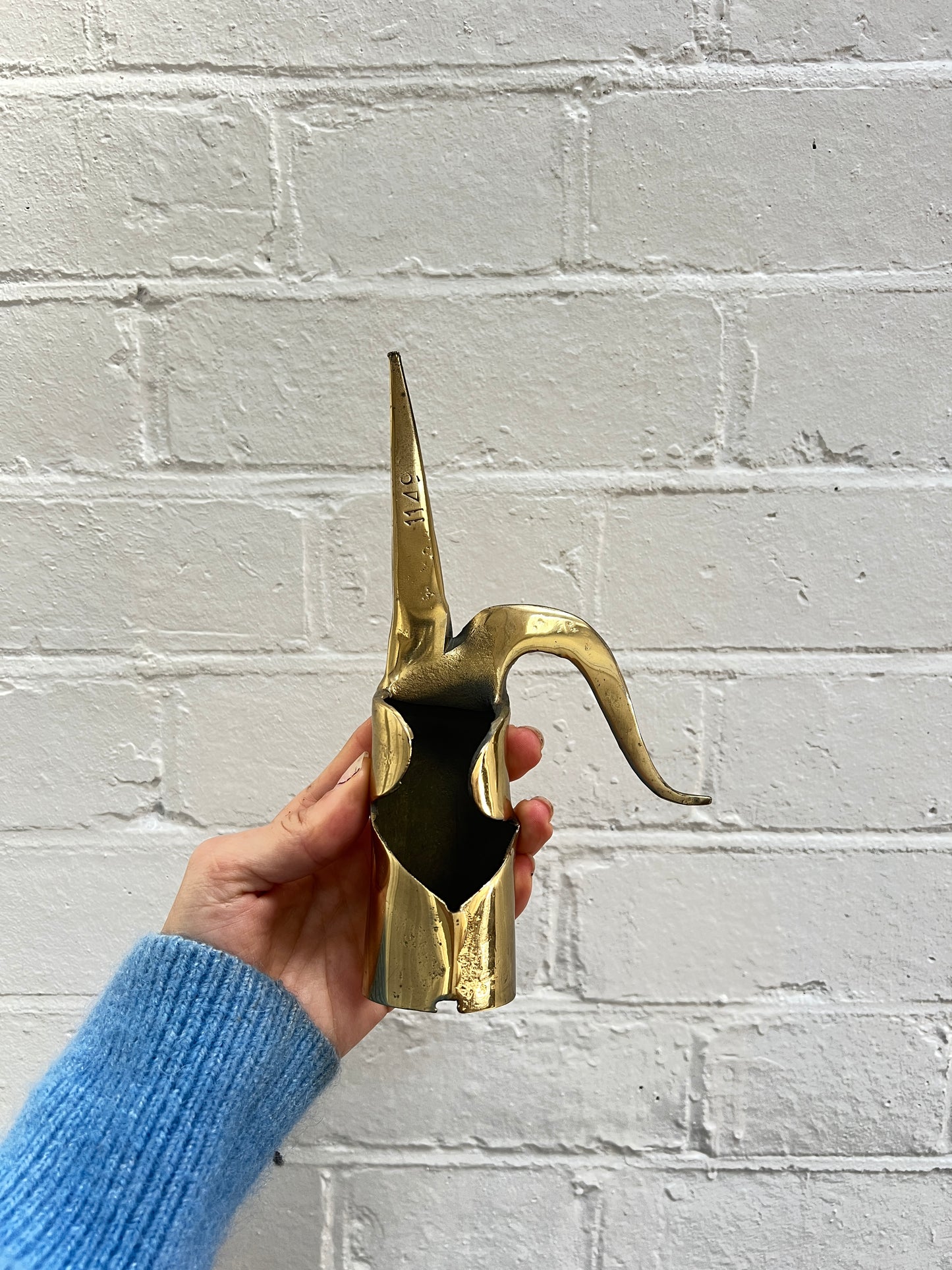 THREE BRASS ORNAMENTS