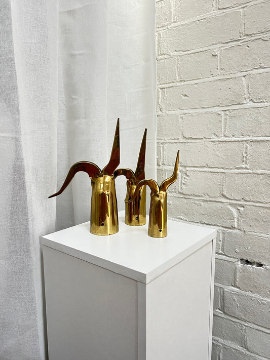 THREE BRASS ORNAMENTS