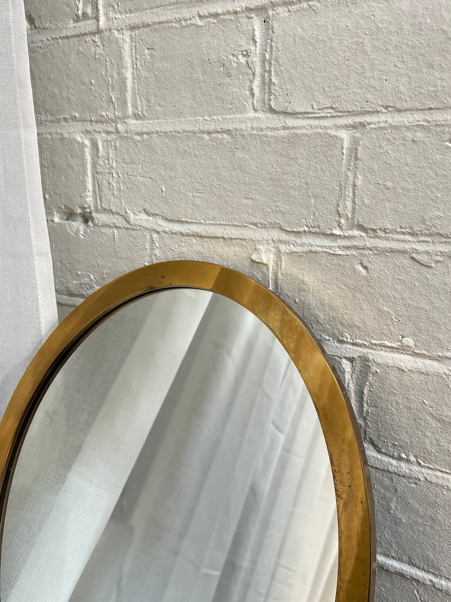 SMALL BRASS OVAL MIRROR